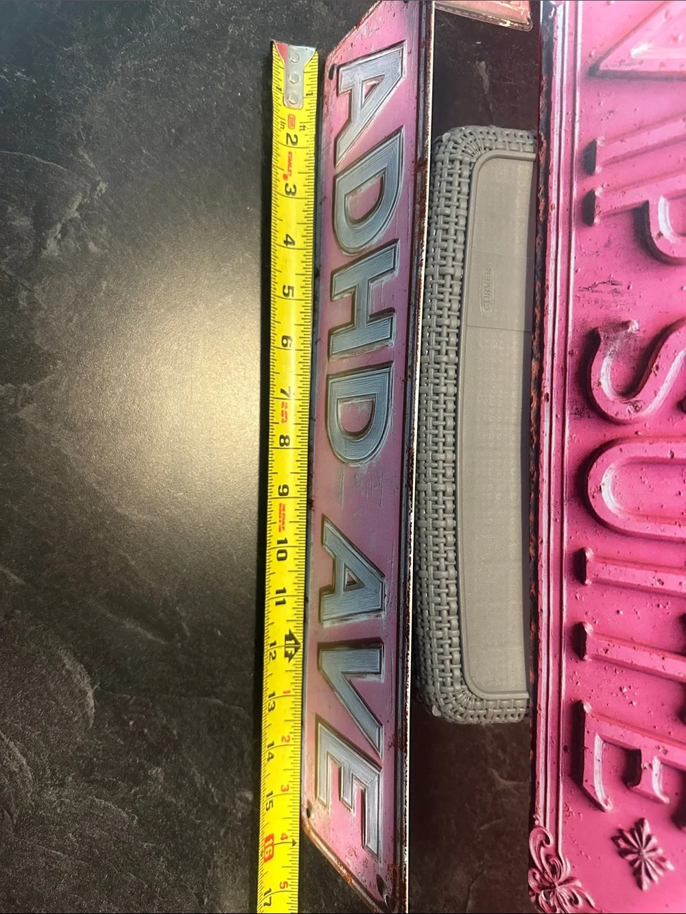 Pink Floral wall curtain with Pink Decorative Signs and metal plates.